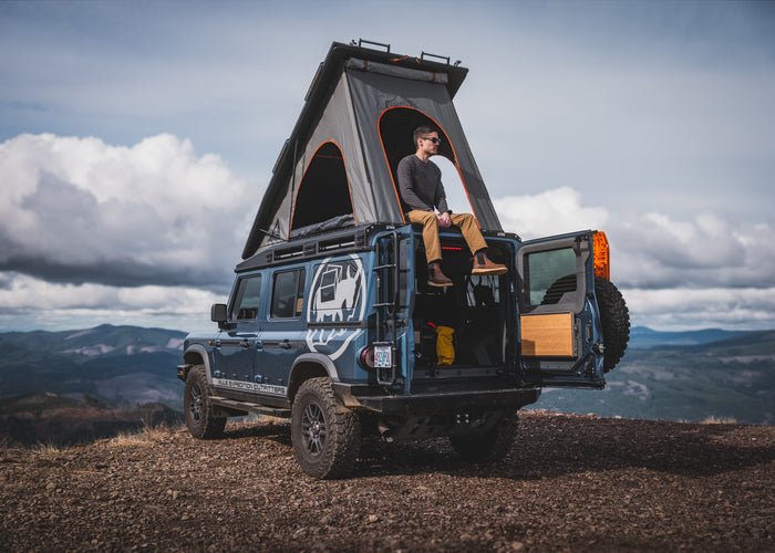 Mule Ineos Grenadier with Alu Cab camper popped open